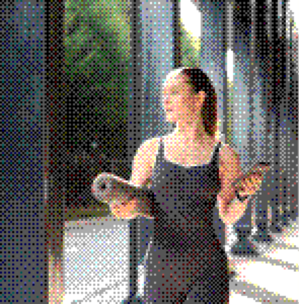 Woman holding a yoga mat and a smartphone