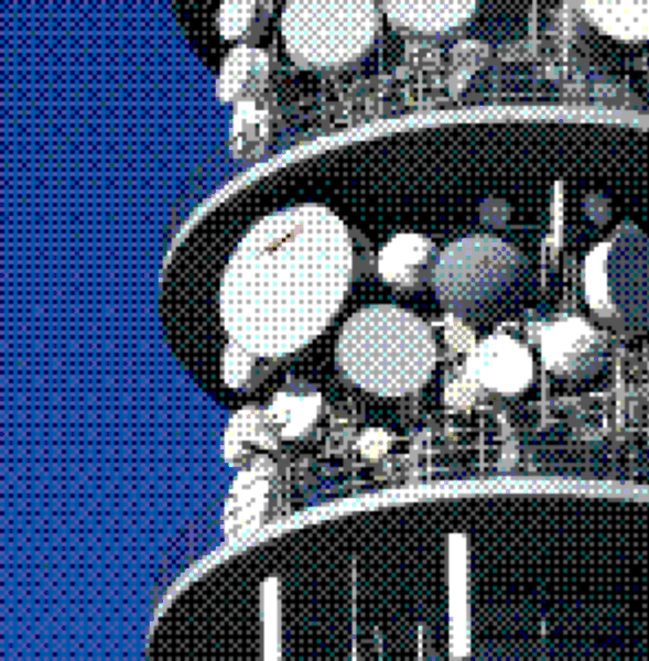 Telecommunications tower with antennas against a blue sky