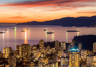 City skyline and bay at sunset