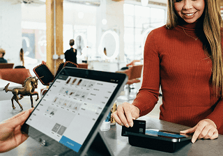 Retail employee using a tablet point-of-sale system