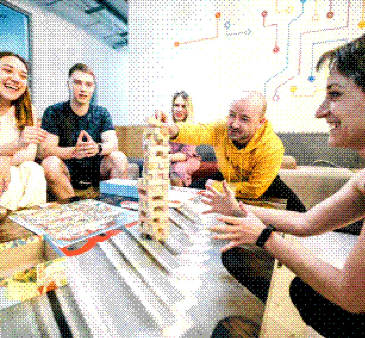 Colleagues playing a tower-building game during a team break