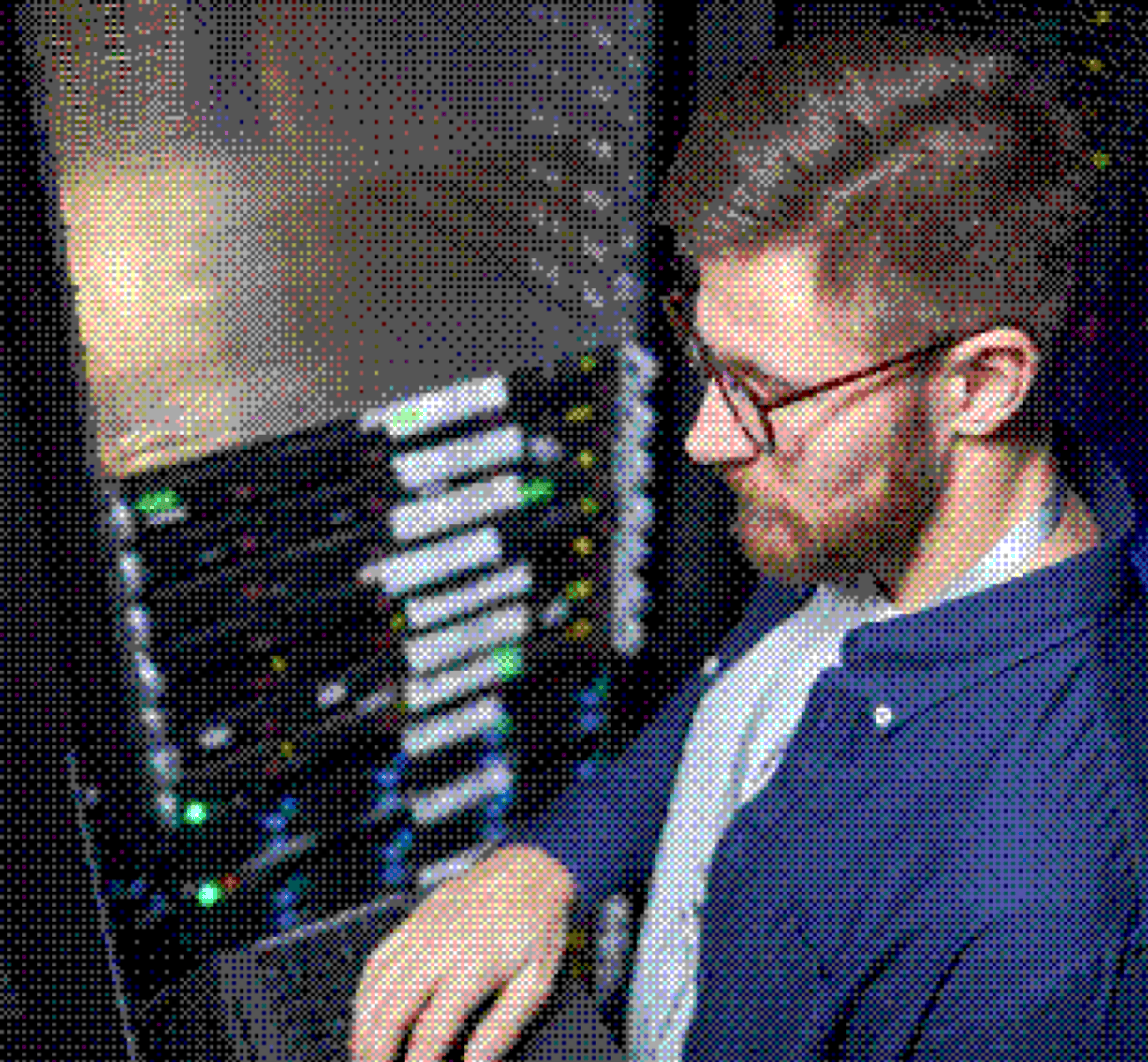 Engineer working next to a server rack